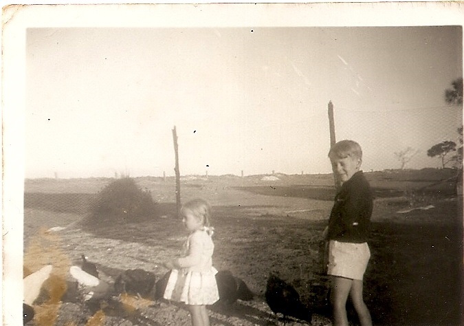 Maurice and Penny Rose feeding chickens