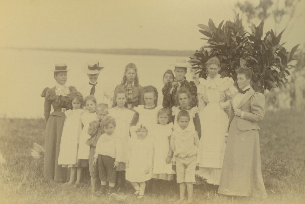 Group photograph of women and children on the foreshore