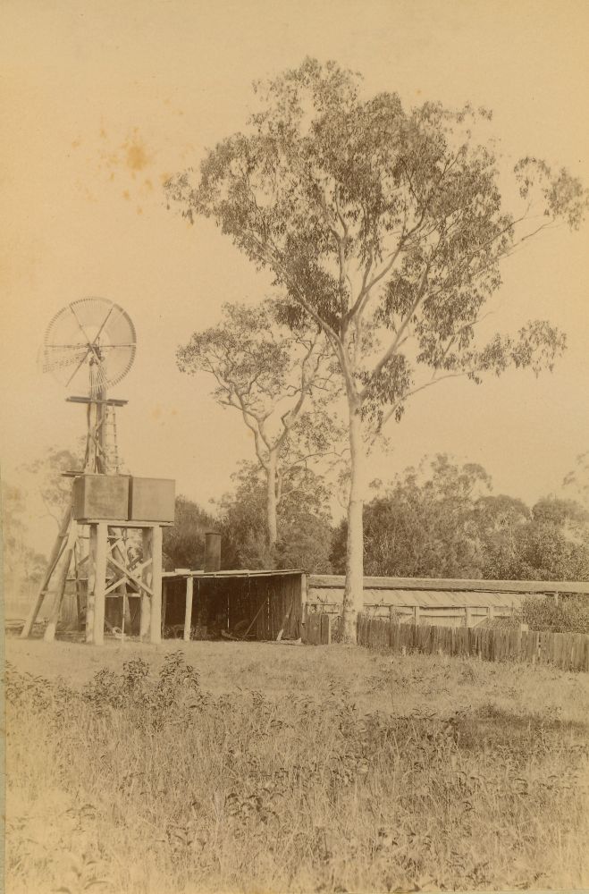 Shed with water tanks and windmill