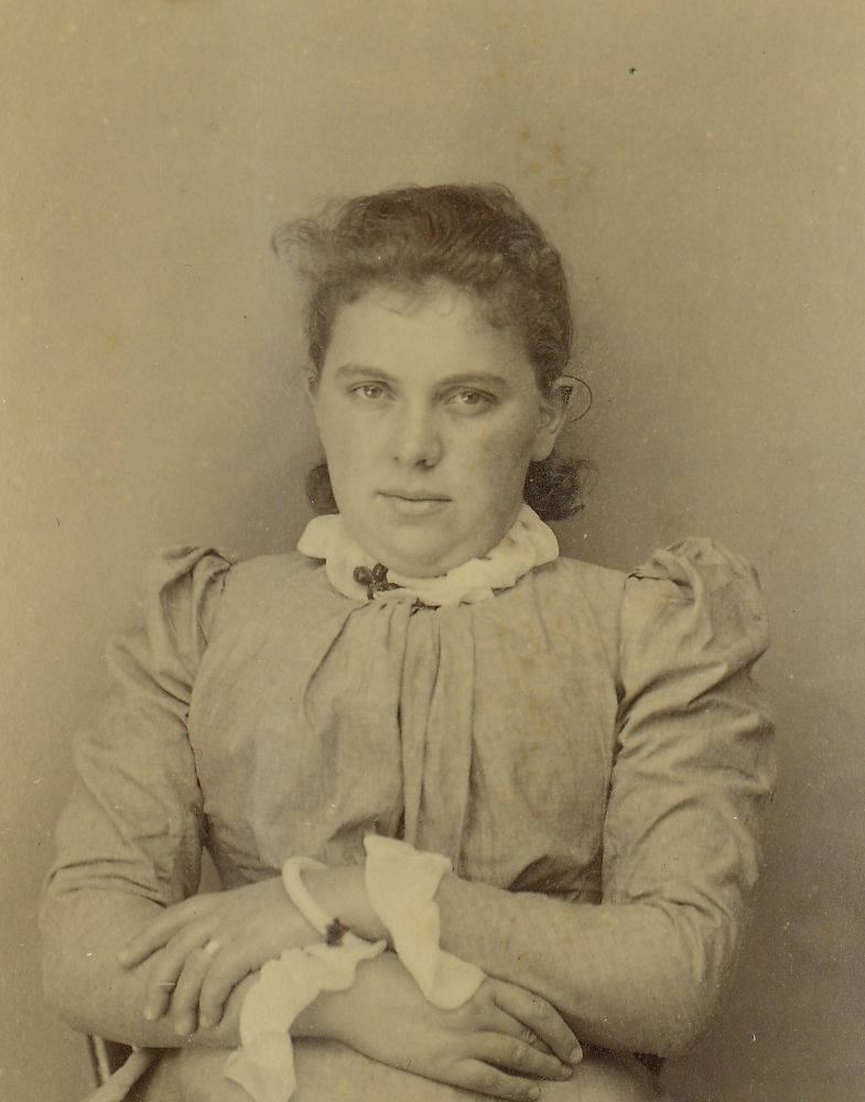 Portrait photograph of a young lady sitting
