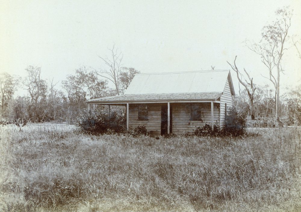 Small house surrounded by bushland
