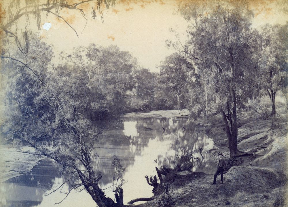 Man standing on the banks of the Warrego River