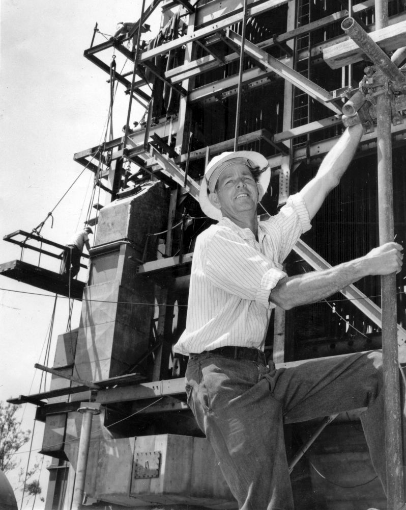 Clarrie Dunstan standing on framework