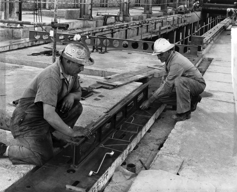 Bob Chambers and Harry Pollock working on the floor