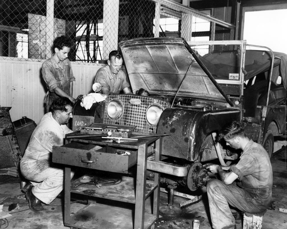 Men in the automotive workshop working on a Landrover