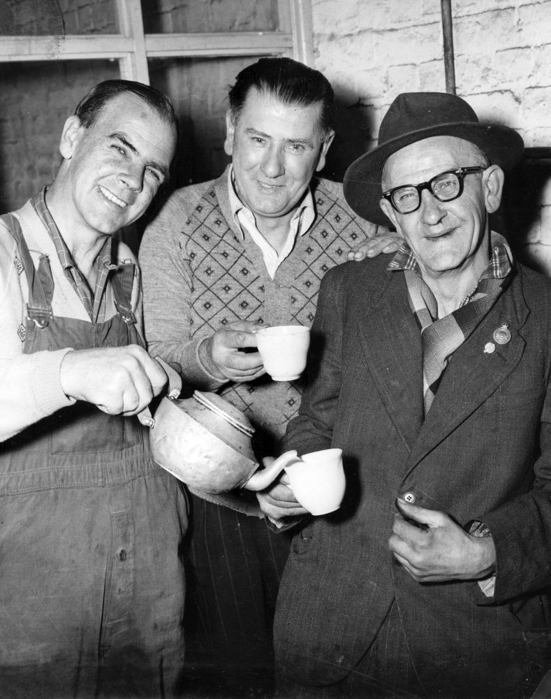 Three workers enjoying afternoon tea