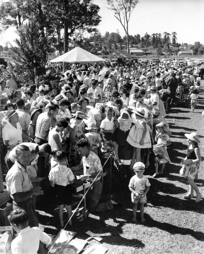 Children receiving their gifts at a Christmas party