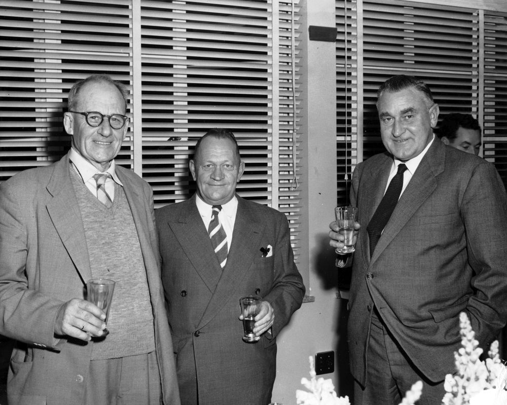 Three men attend a function