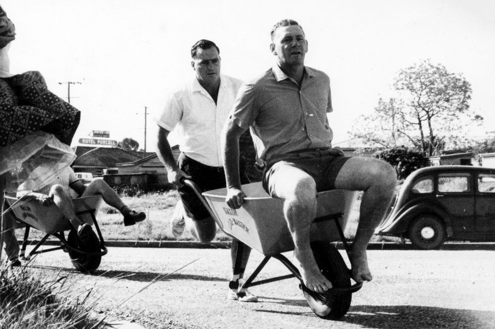 Wheelbarrow race through the streets of Petrie
