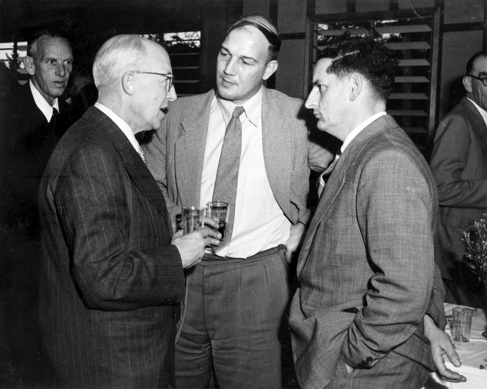 Sir Charles S. Booth, APM Chairman of Directors (1959-1965) (left), with guests at a social function