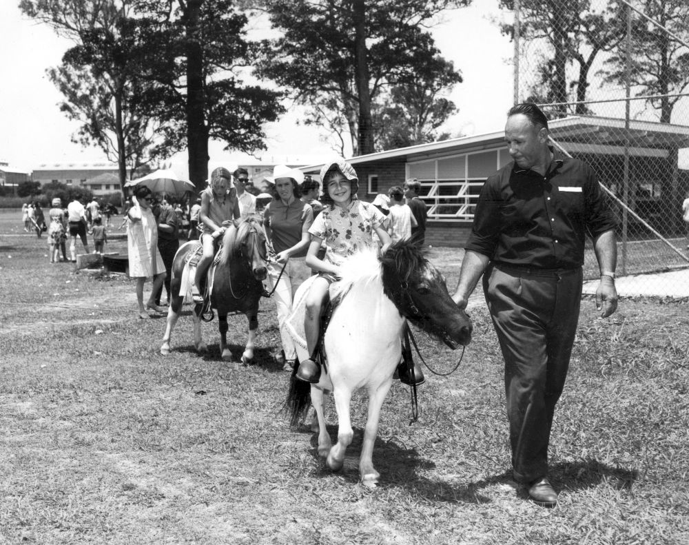 Children enjoying pony rides