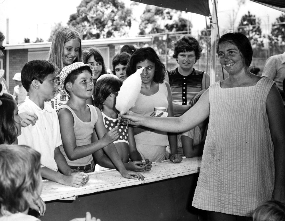 Children at a Christmas party getting some fairy floss