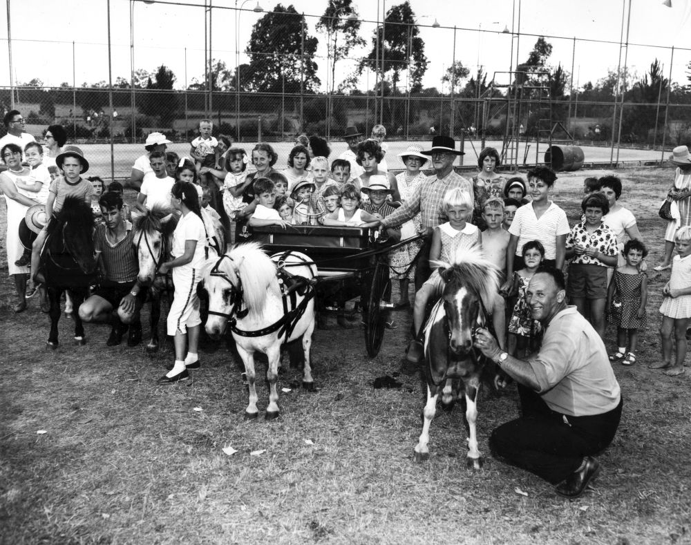 Children enjoying rides at a Christmas party