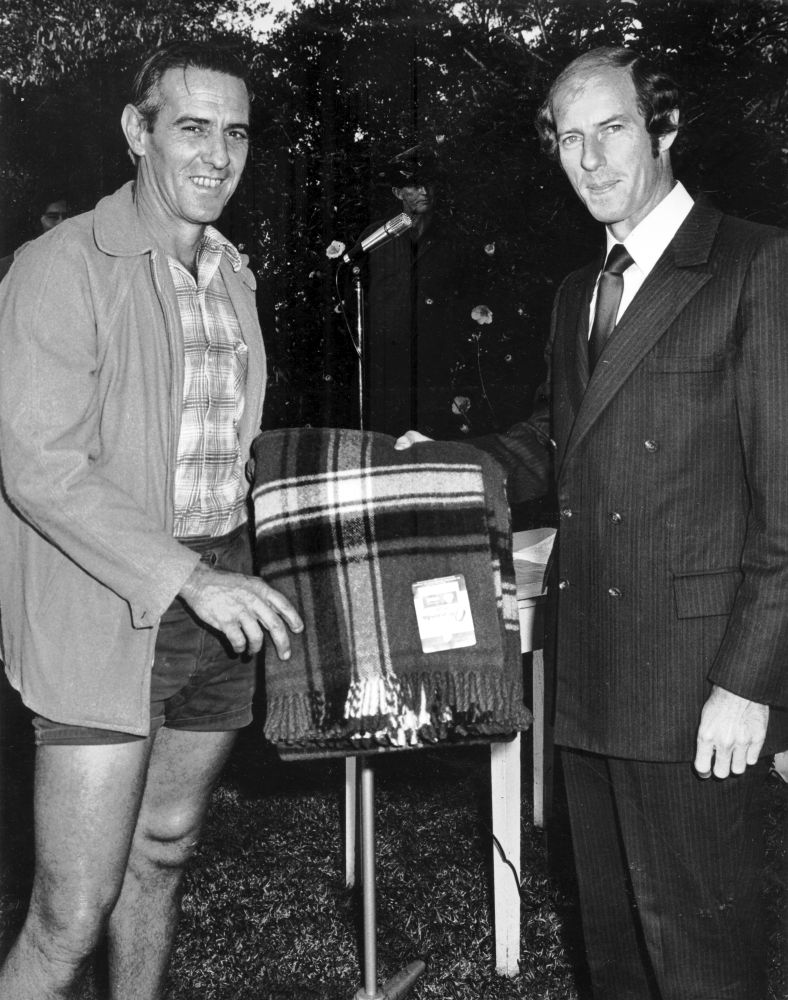 Ron Ferriday (White Shift Dryerman) receiving a gift at a safety awards presentation, 1976