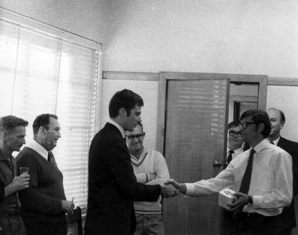 Staff gathering for presentation