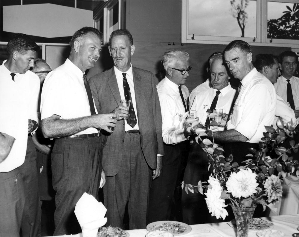Les Schultz (centre left in foreground) talking with Gus Gehrmann