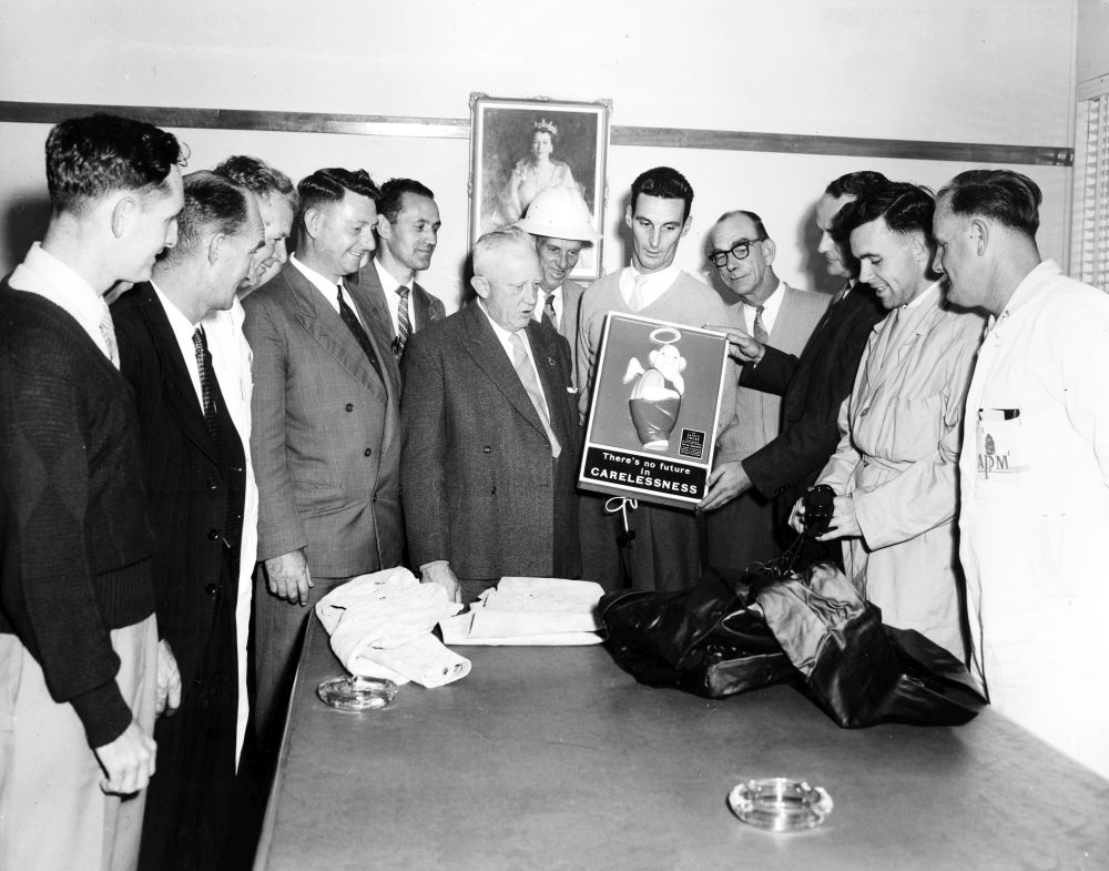 Honourable K.J. Morris (M.L.A.) with a group of workers