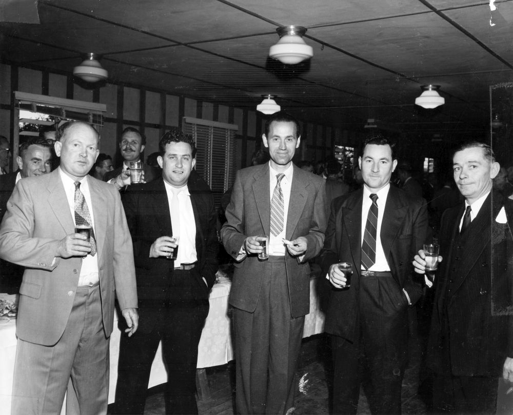 Production staff celebrating the start-up of the machinery at the Petrie Mill, 30 August 1957