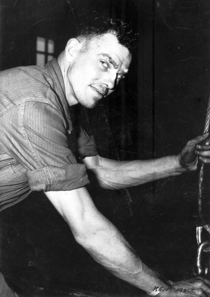 Ken Mole (Winderman) preparing reels for rewinding at the Petrie Mill