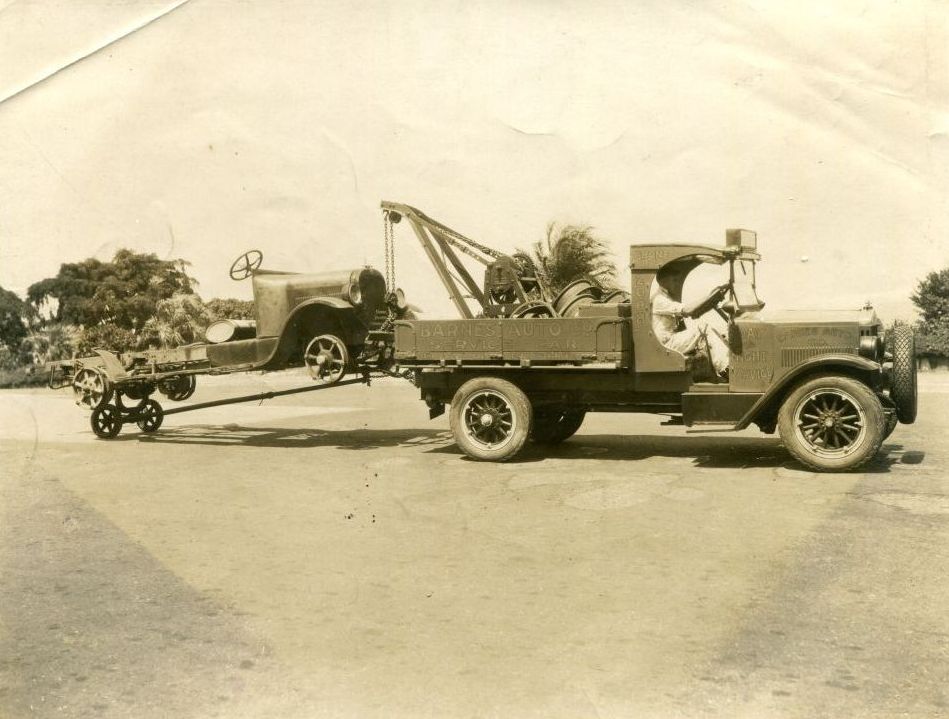Barnes Auto Service truck towing another vehicle