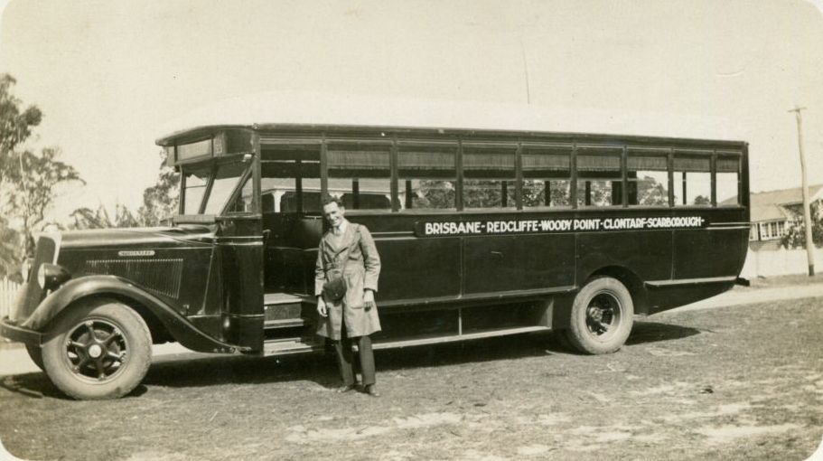 Brisbane to Scarborough bus with unknown driver standing alongside