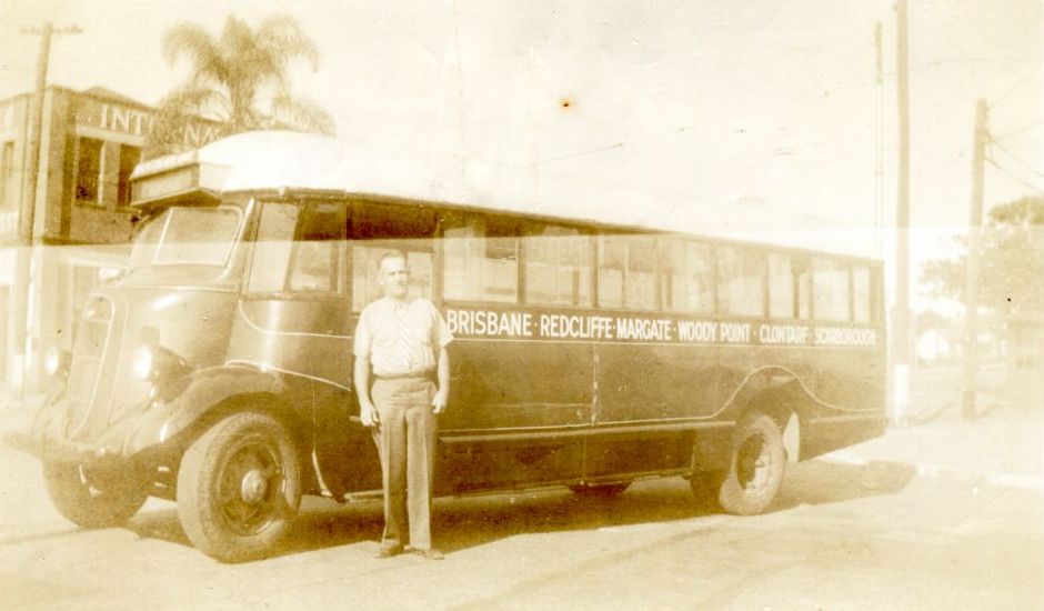 Jack Kruck standing next to Elson's Studebaker bus