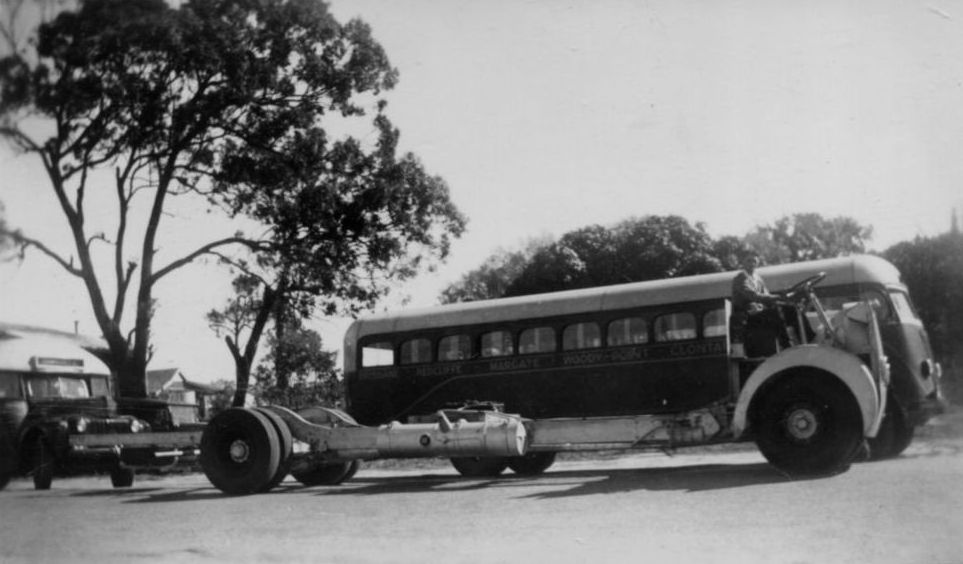 Bus parked with another bus chassis parked alongside