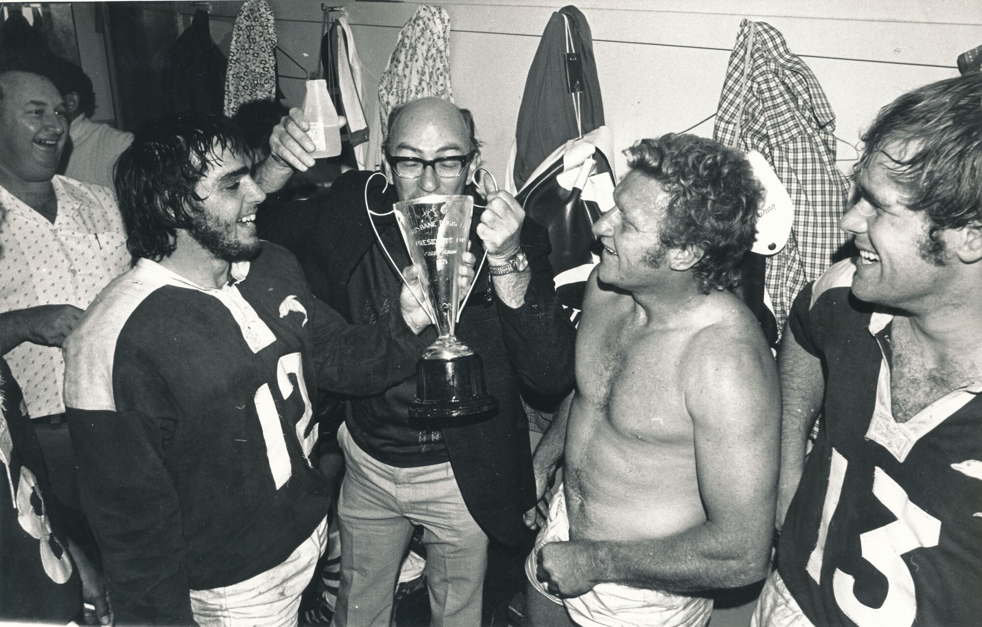 Tosser Turner drinking from trophy cup