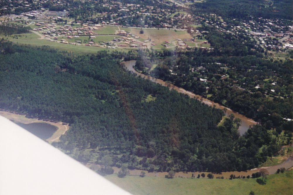 Aerial photograph looking north over Petrie and the North Pine River
