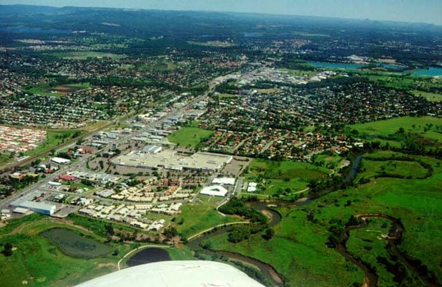 Aerial photograph looking northwest over the South Pine River and Westfield Shopping Centre, Strathpine