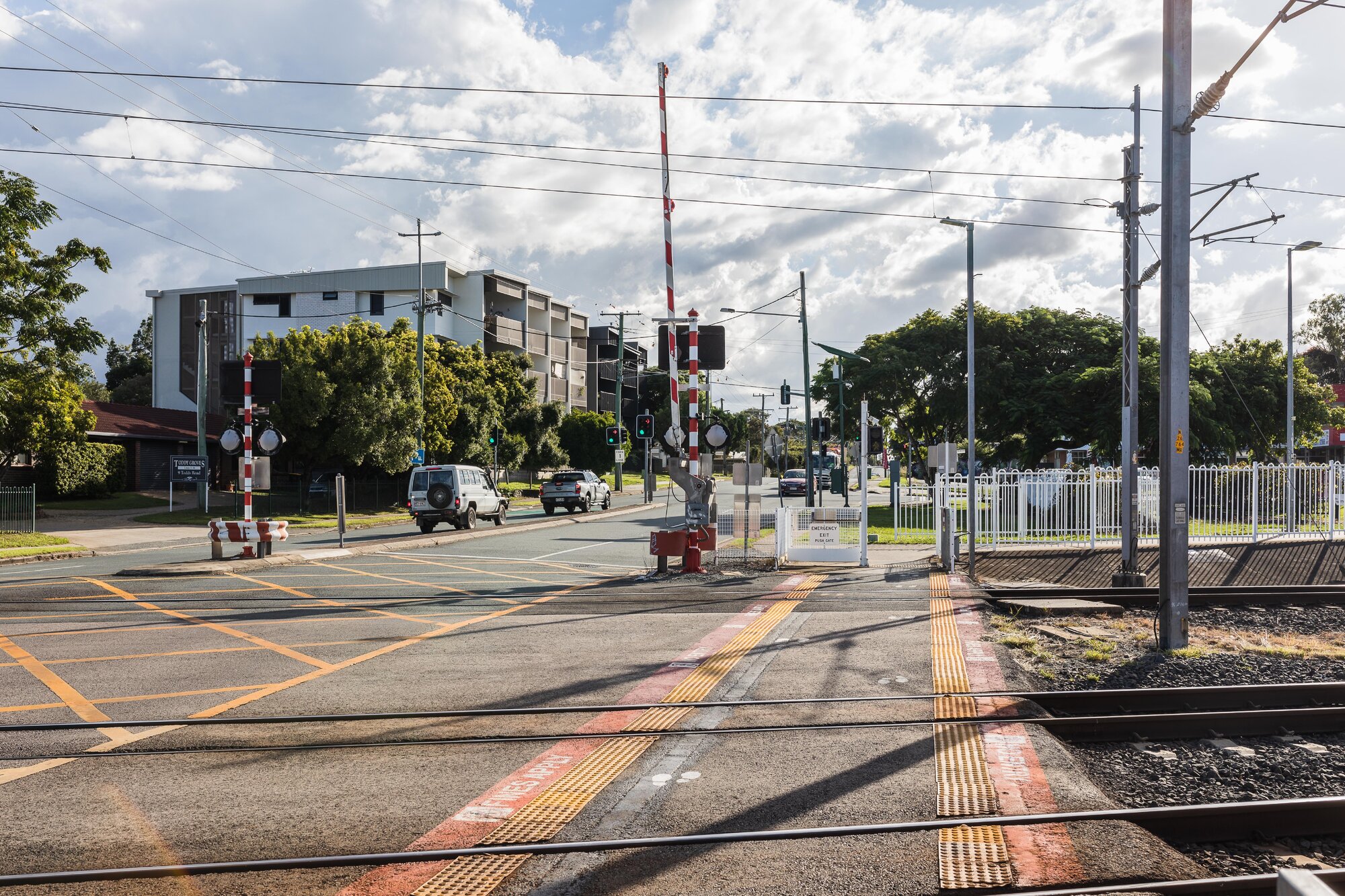 Railway level crossing on Todds Road Lawnton - looking west towards apartment building