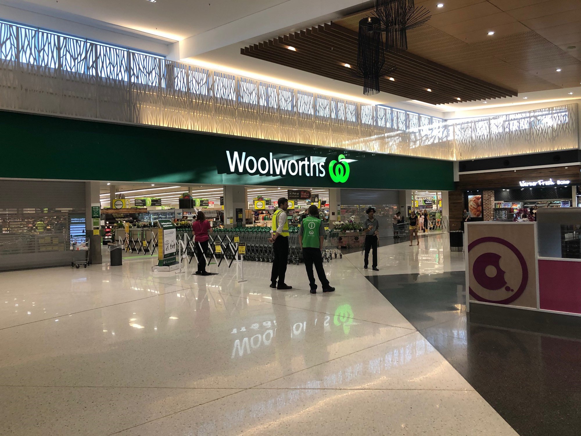 Woolworths Supermarket - Warner Marketplace Samsonvale Road Warner - 10 April 2020 - staff managing customers in and out