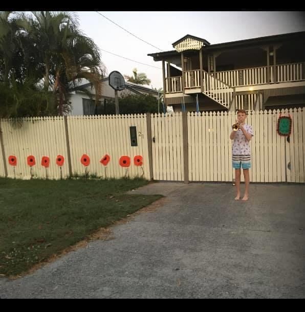Scarborough Road Redcliffe - 25 April 2020 - Benjamin Hay playing last post in his driveway at Redcliffe