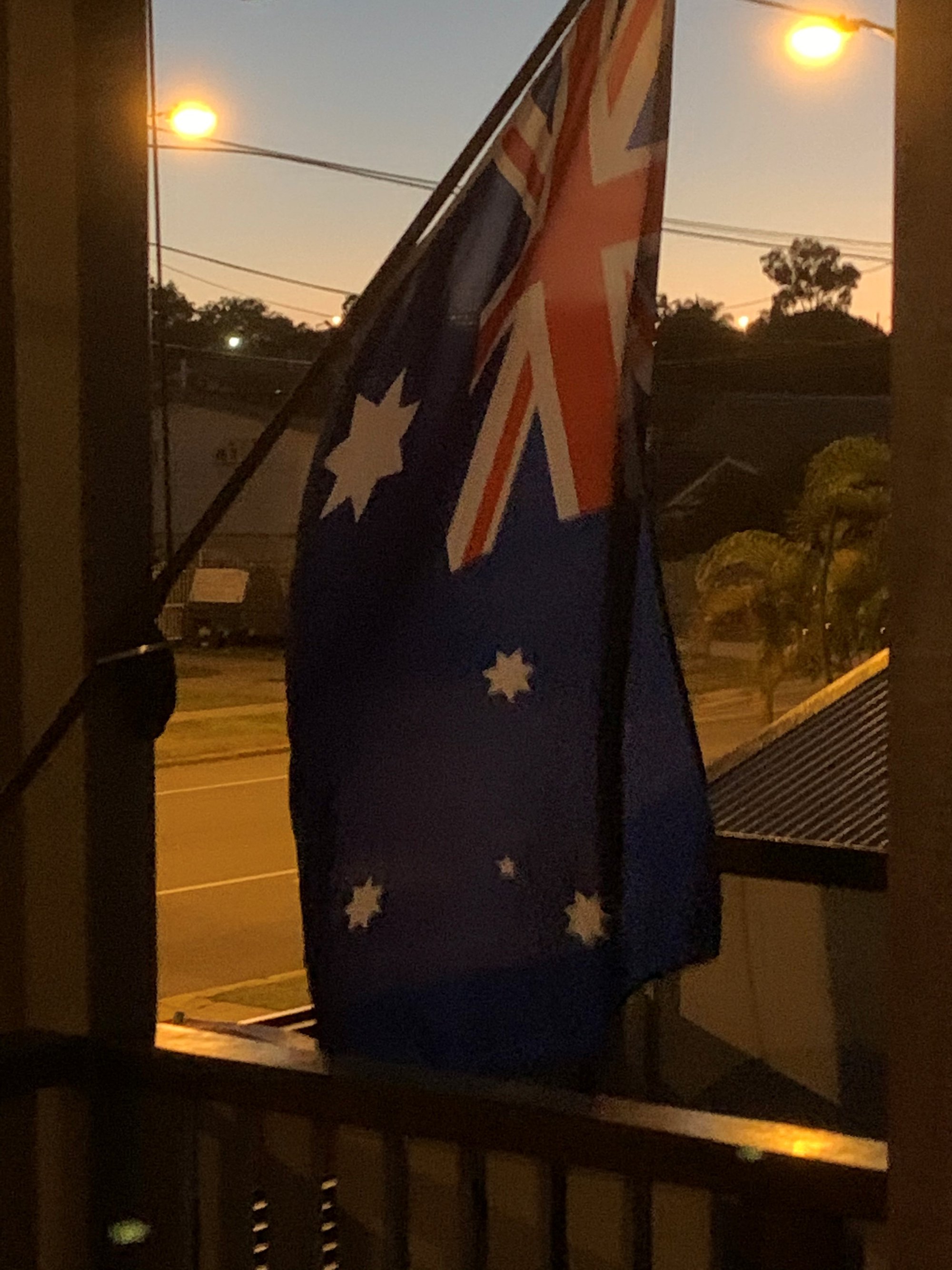 Griffith Road Scarborough - 25 April 2020 - Australian flag on balcony at dawn - 001
