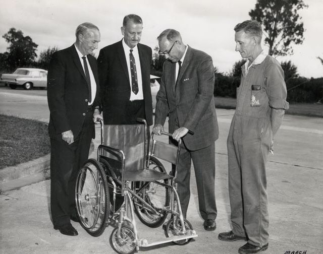 4 men with wheelchair