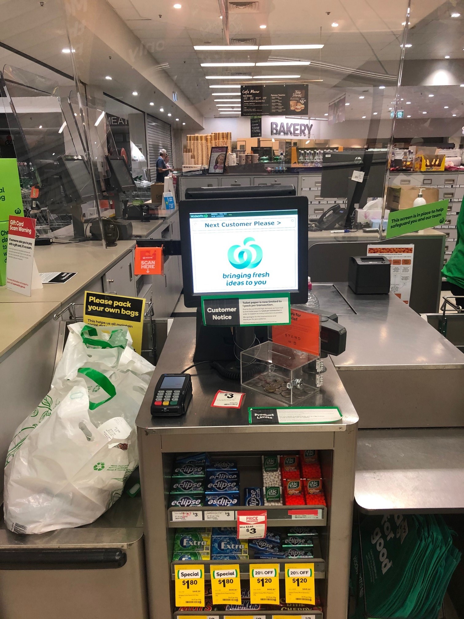 Woolworths Supermarket - Warner Marketplace Samsonvale Road Warner - 10 April 2020 - clear perspex barrier for cashiers and signage