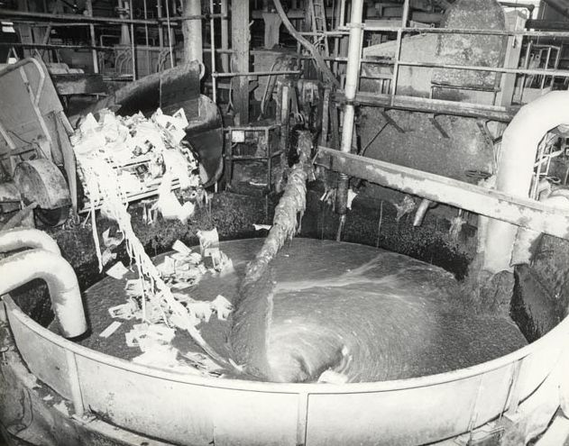 Recycled paper being fed into Pulper