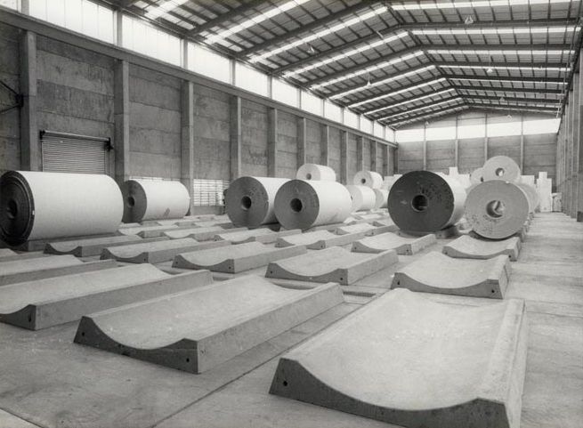 Cartonboard Rolls on Platforms in Storage Shed