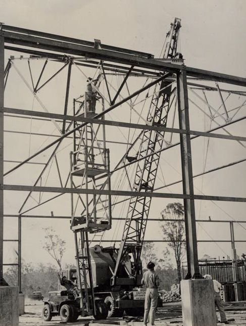 Building under construction - Crane lifting beams