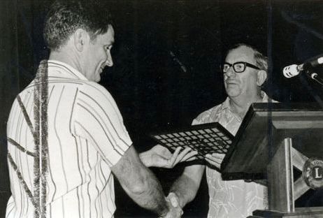 Deception Bay Lions Club President, Terry Head accepts an Award