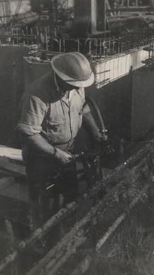 Man in hard hat using air drill