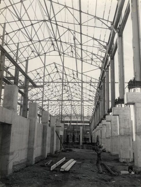 Mill under construction - worker using a hoist