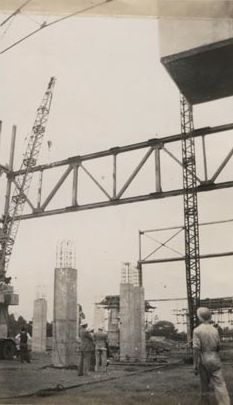 Mill construction - Worker in right foreground