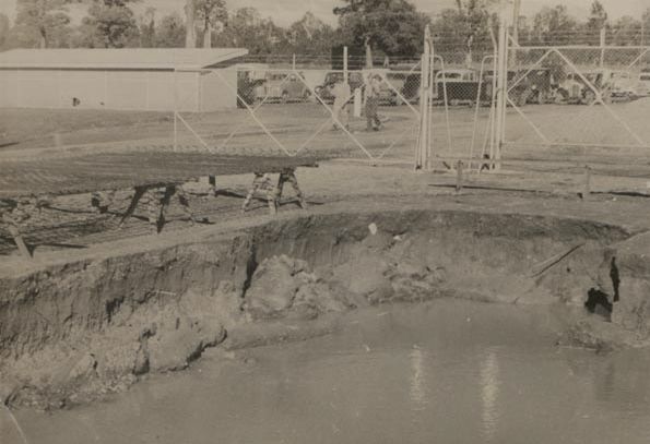 Workers approaching security fence