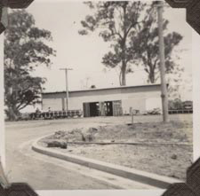 Shed with kerb and channelling in foreground