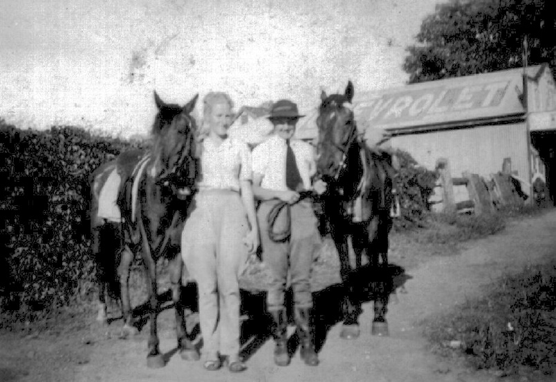 Cynthia Henderson (left) and friend with horses in King Street Caboolture