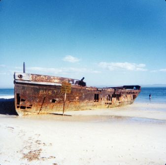 SS Cormorant resting on the beach at Bongaree during the mid 1970s