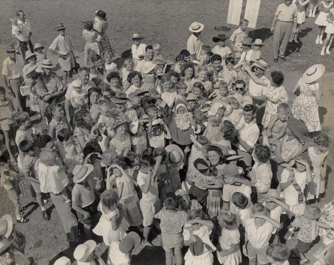 Christmas Party 1958 - Crowding around Santa