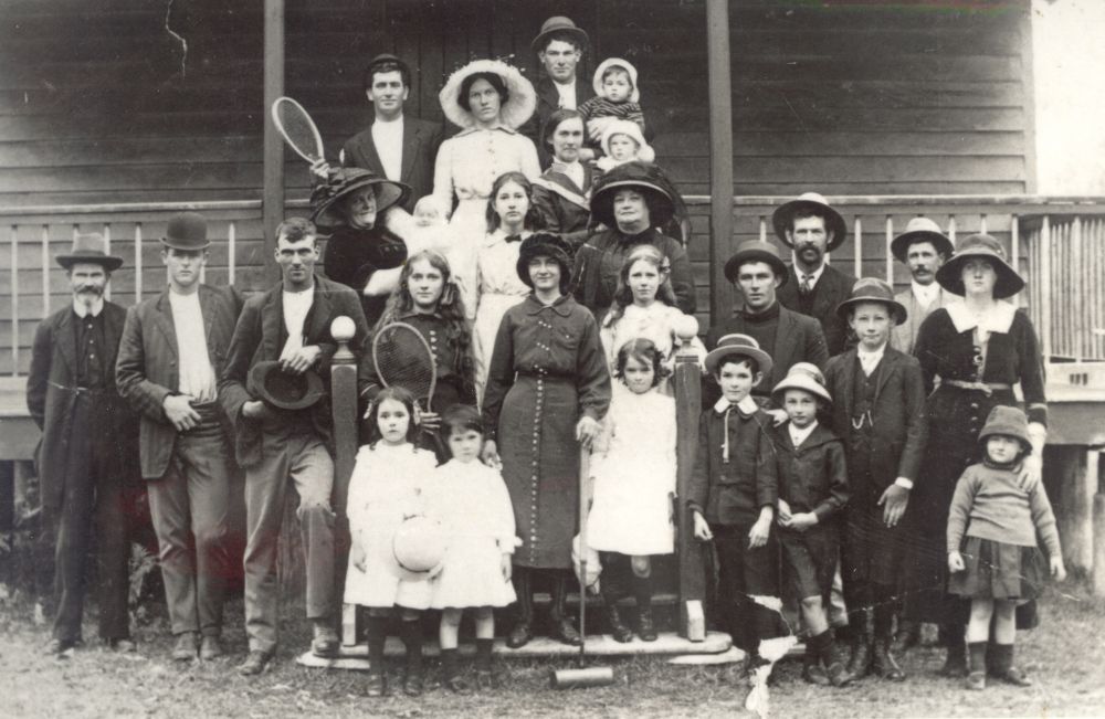 Group standing on the verandah steps of Delaneys Creek Hall in 1912