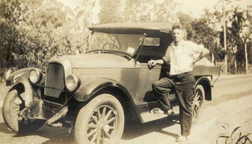 Albert (Wally) Lehman standing beside his truck in the 1940s